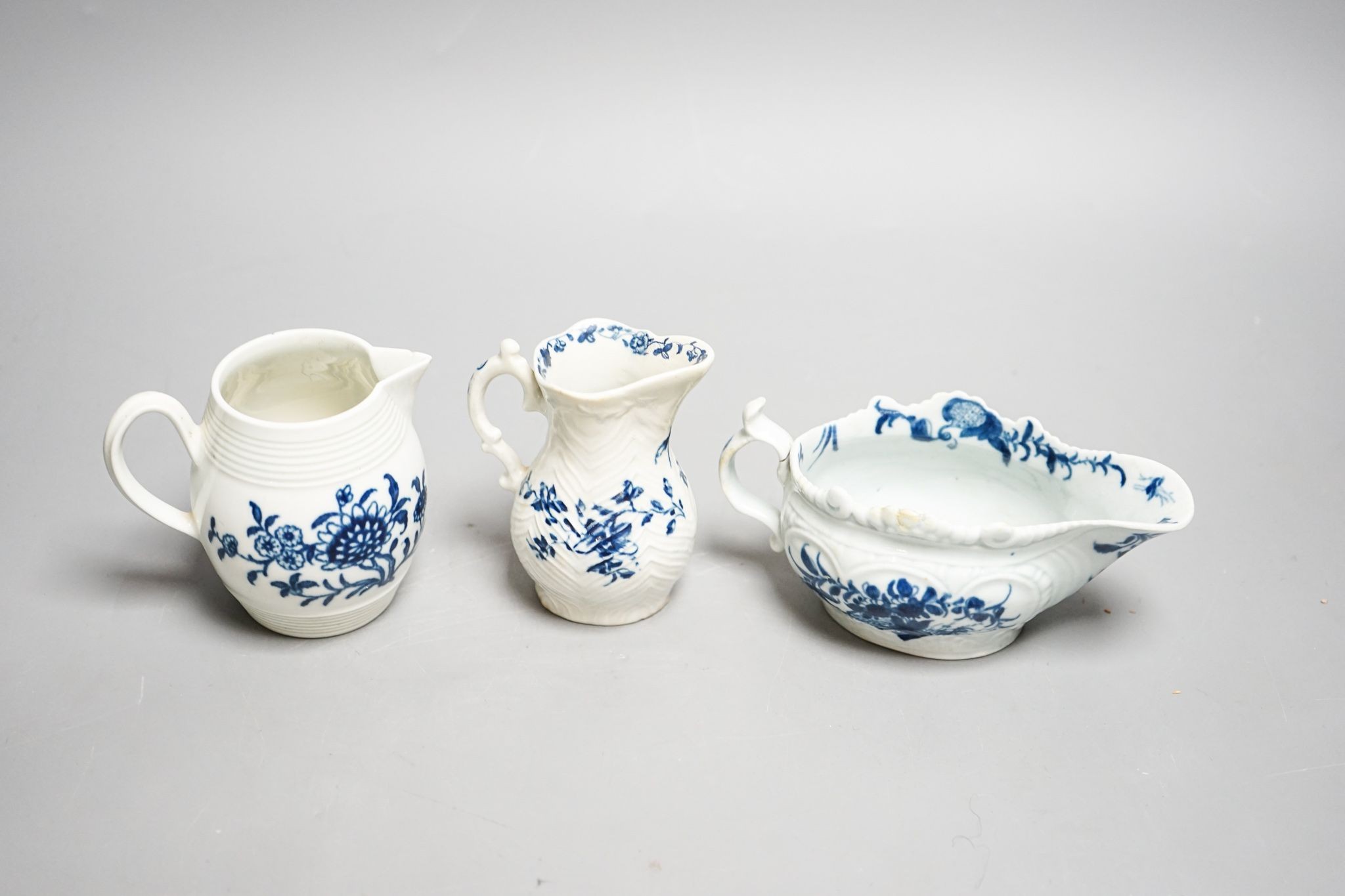 A Worcester blue and white sauceboat, sparrow beak milk jug and a Mansfield pattern milk jug, tallest 9 cm